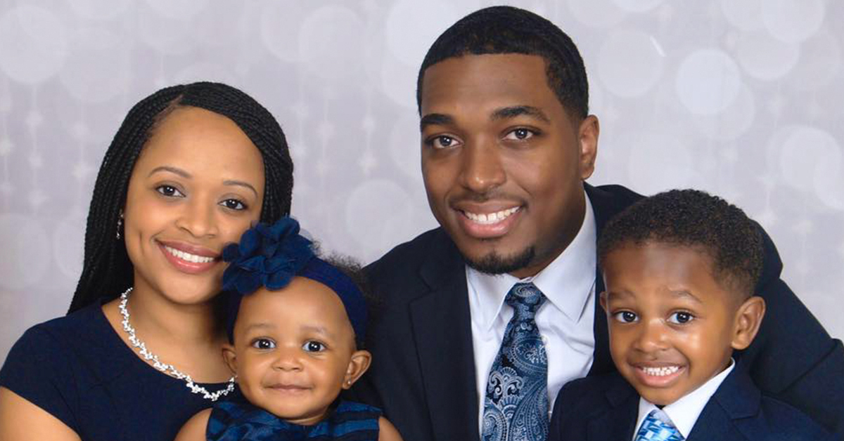Emmanuel, Capital One associate and working dad, poses with his wife and two children